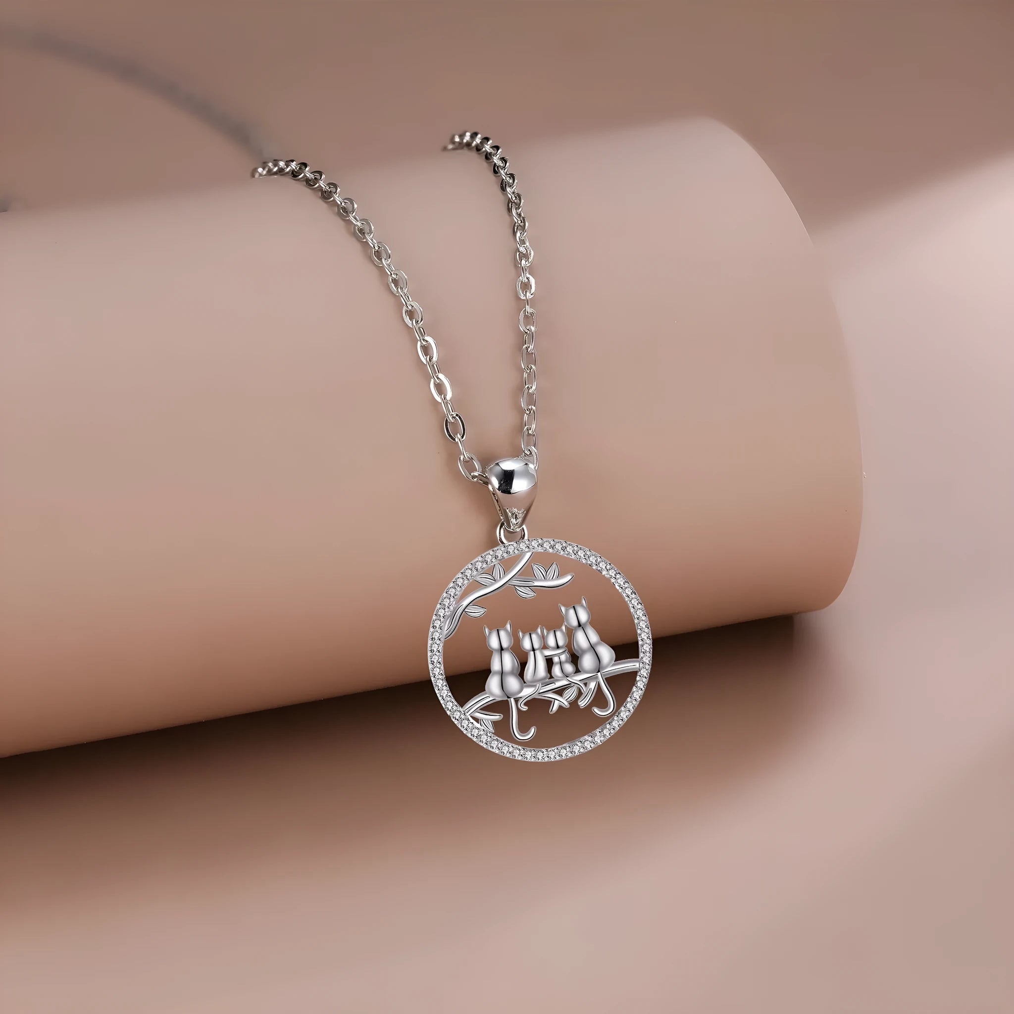 Women's copper necklace with four cat kitten pendants on cross chain, electroplated finish.