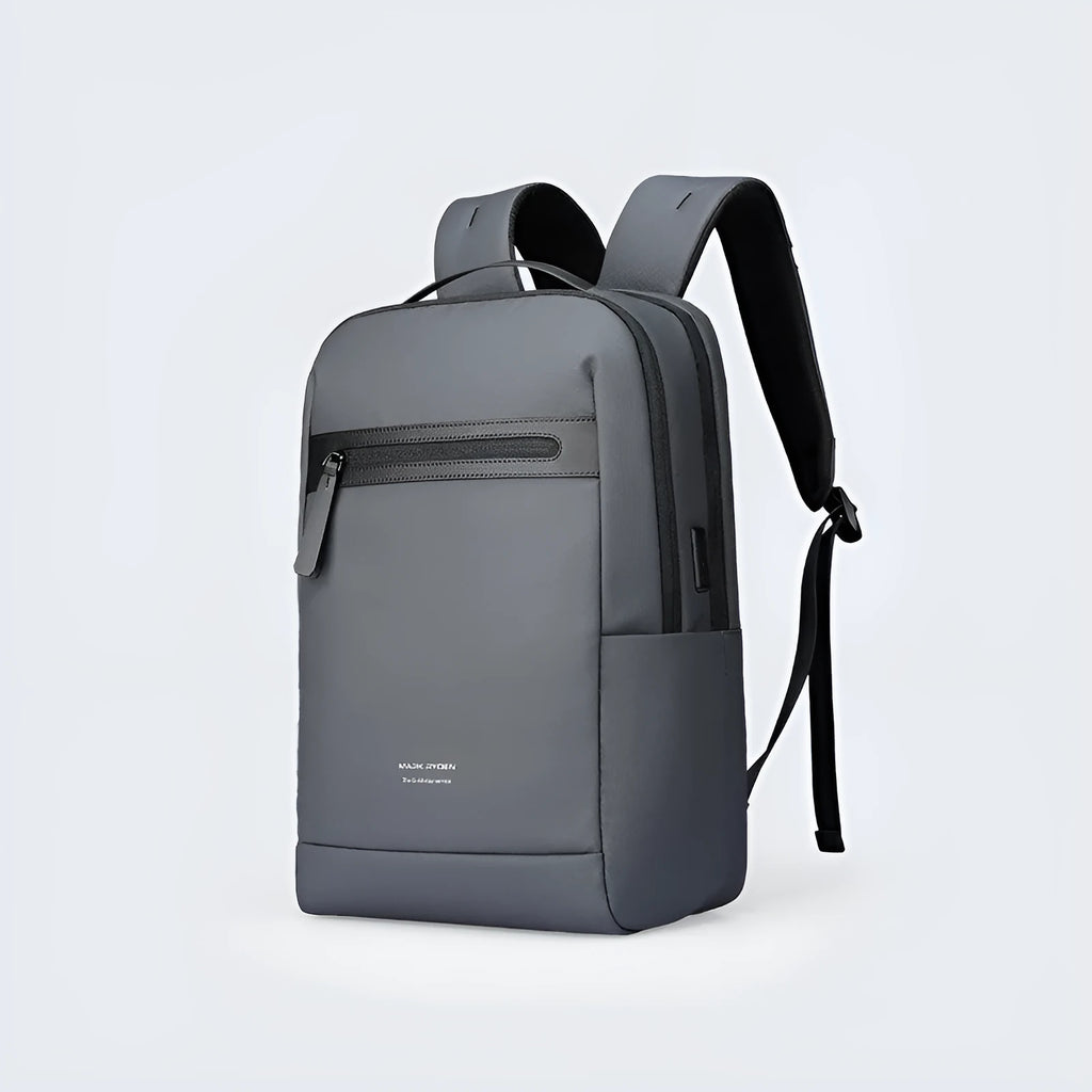 Graphite grey Oxford cloth business backpack featuring an external USB charging port on the shoulder strap.
