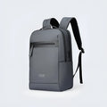 Graphite grey Oxford cloth business backpack featuring an external USB charging port on the shoulder strap.