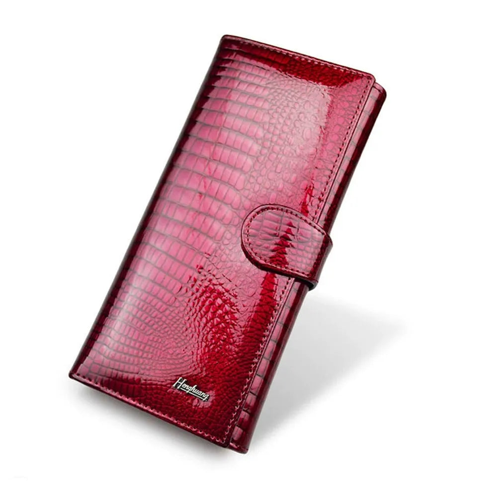 Women's leather coin purse with patent leather crocodile pattern texture in wine red colour