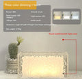Clear acrylic geometric ice cube shaped small night light with internal LED glow.