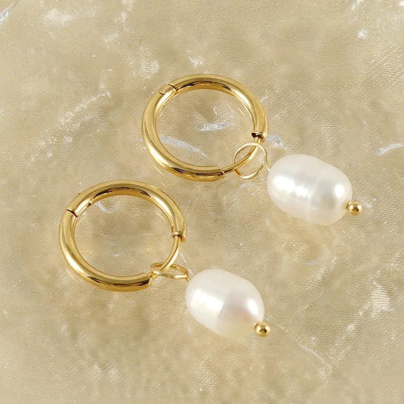 Gold geometric women's earrings with a central pearl, made from stainless steel and titanium steel.