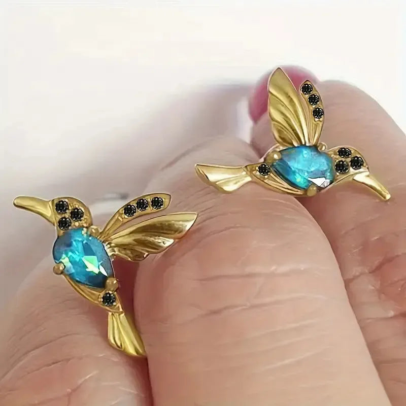 Long style women's earrings with a hanging bird design featuring mixed zirconium wings.