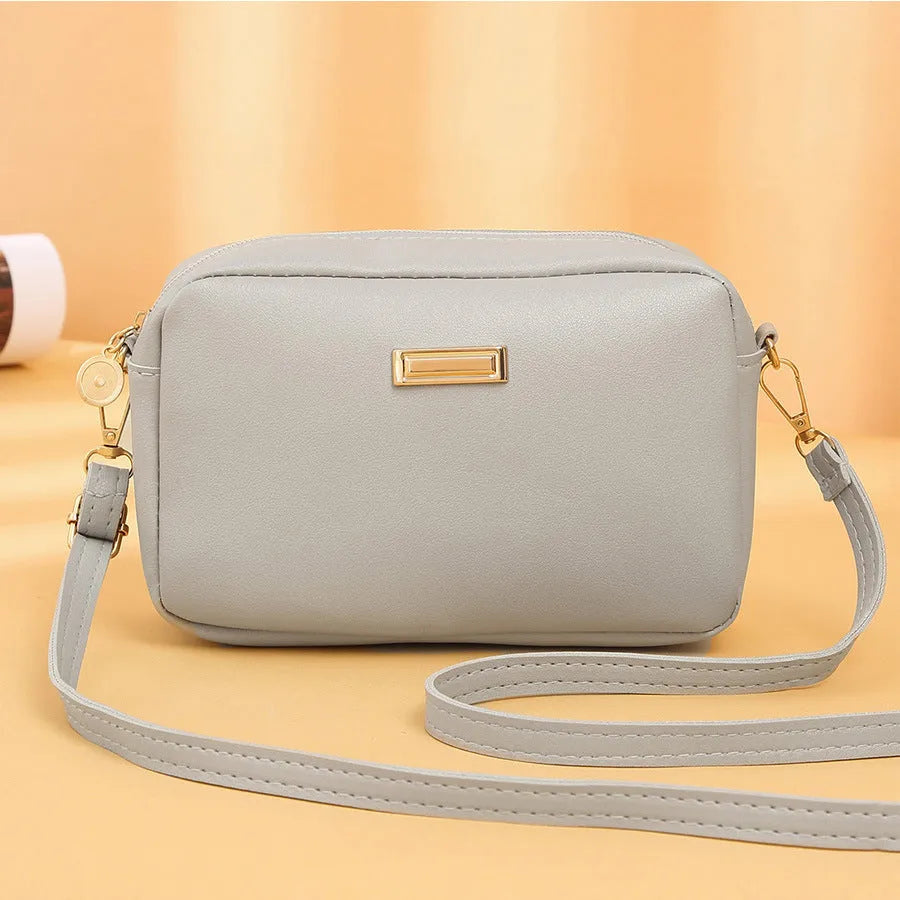 Women's solid colour PU shoulder bag with three-dimensional pocket in five colour options