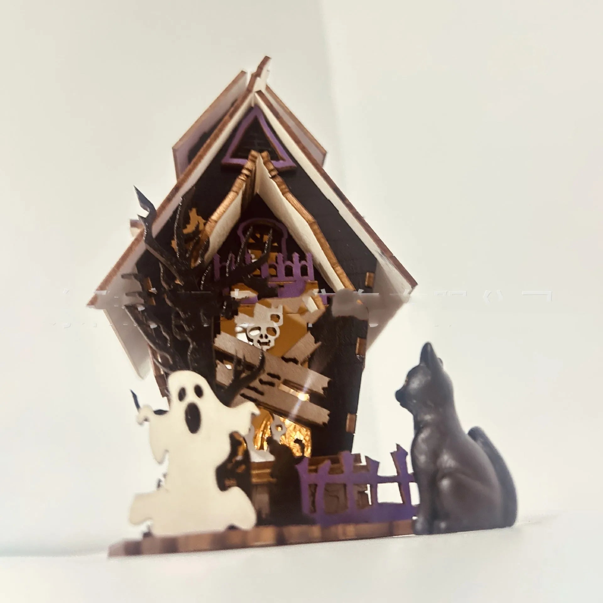 Unpainted wooden haunted house Halloween decoration measuring 14cm wide by 19cm tall