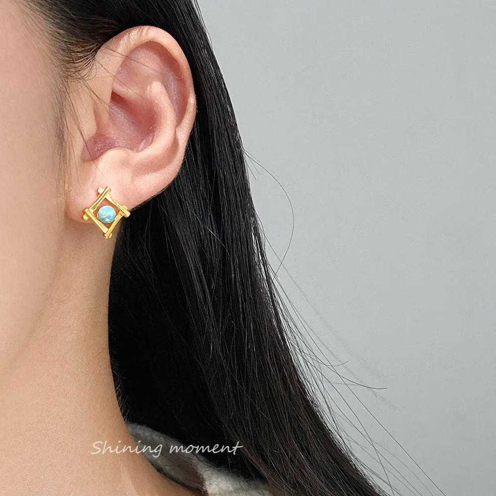 Geometric cross quadrangle stud earrings in 925 silver with Seiko treatment, silver and gold colour options