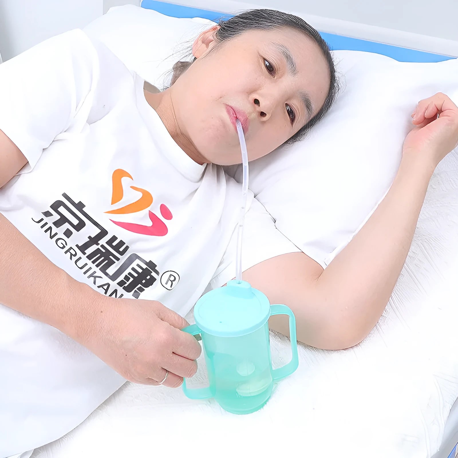 Oblique mouth choke-proof drinking cup for bed-bound adults with optional wrist splint attachment