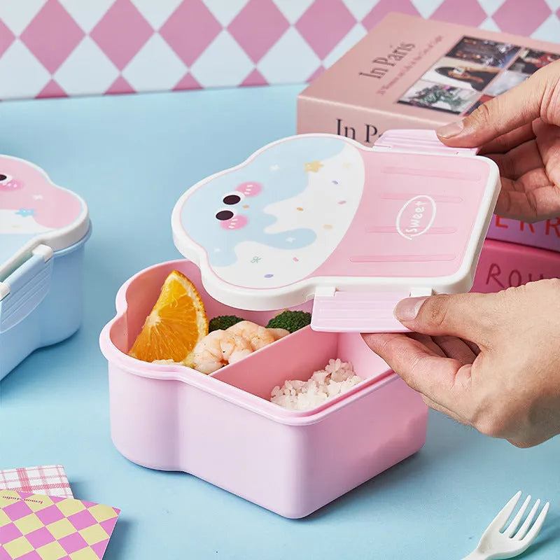 Pink and blue creative ice cream shaped plastic lunch box with spoon and fork on a table.