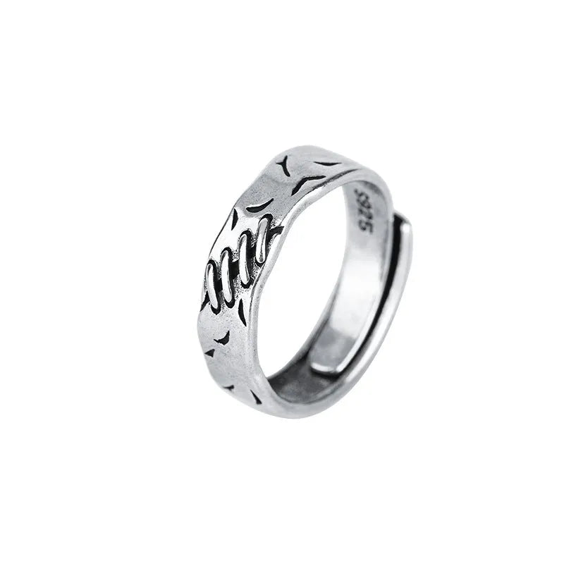 Black geometric copper ring for women with adjustable opening featuring round and oval elements
