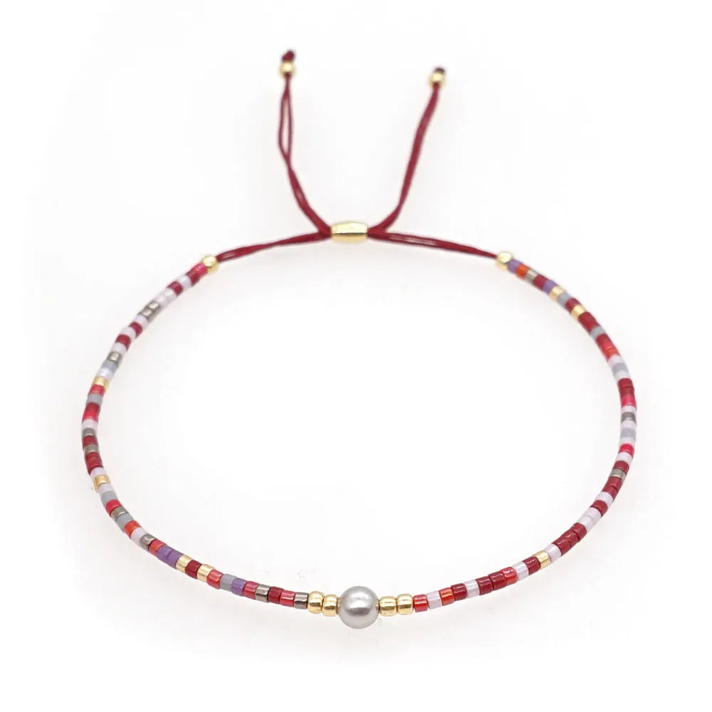 Handmade Bohemian women's bracelet with colourful geometric semi-precious and glass lucky stone beads.