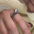 Adjustable copper geometric ring with black pearl detail on open-ended design