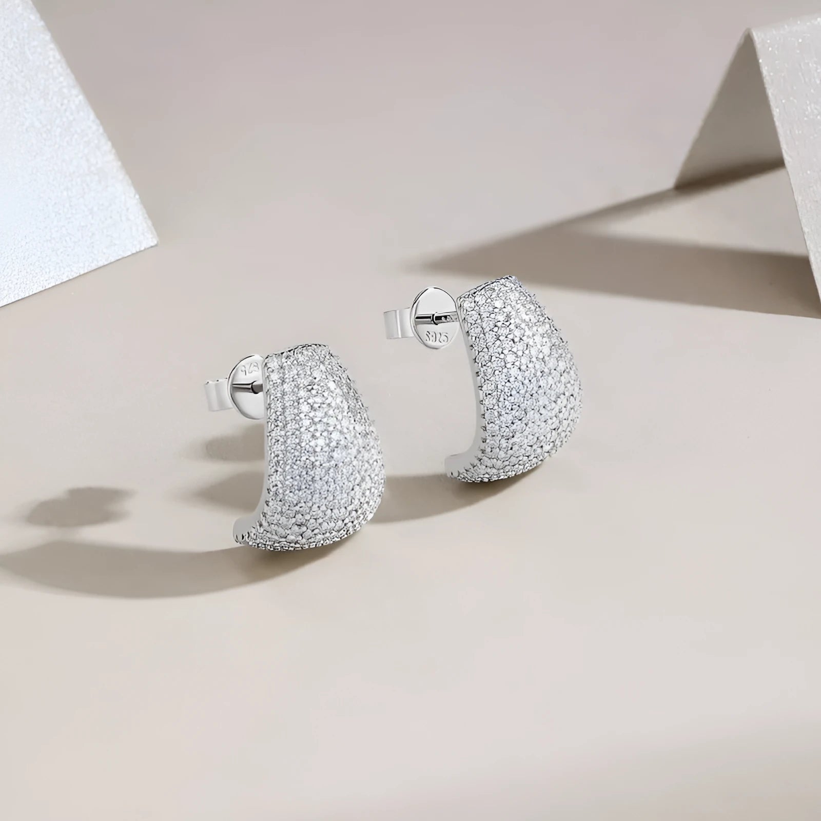 Geometric sterling silver stud earrings with moissanite stones in gift box