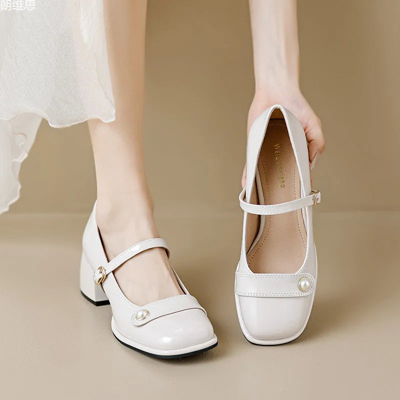 French style chunky heel ankle boots with patent leather upper, square toe, and buckle fastening