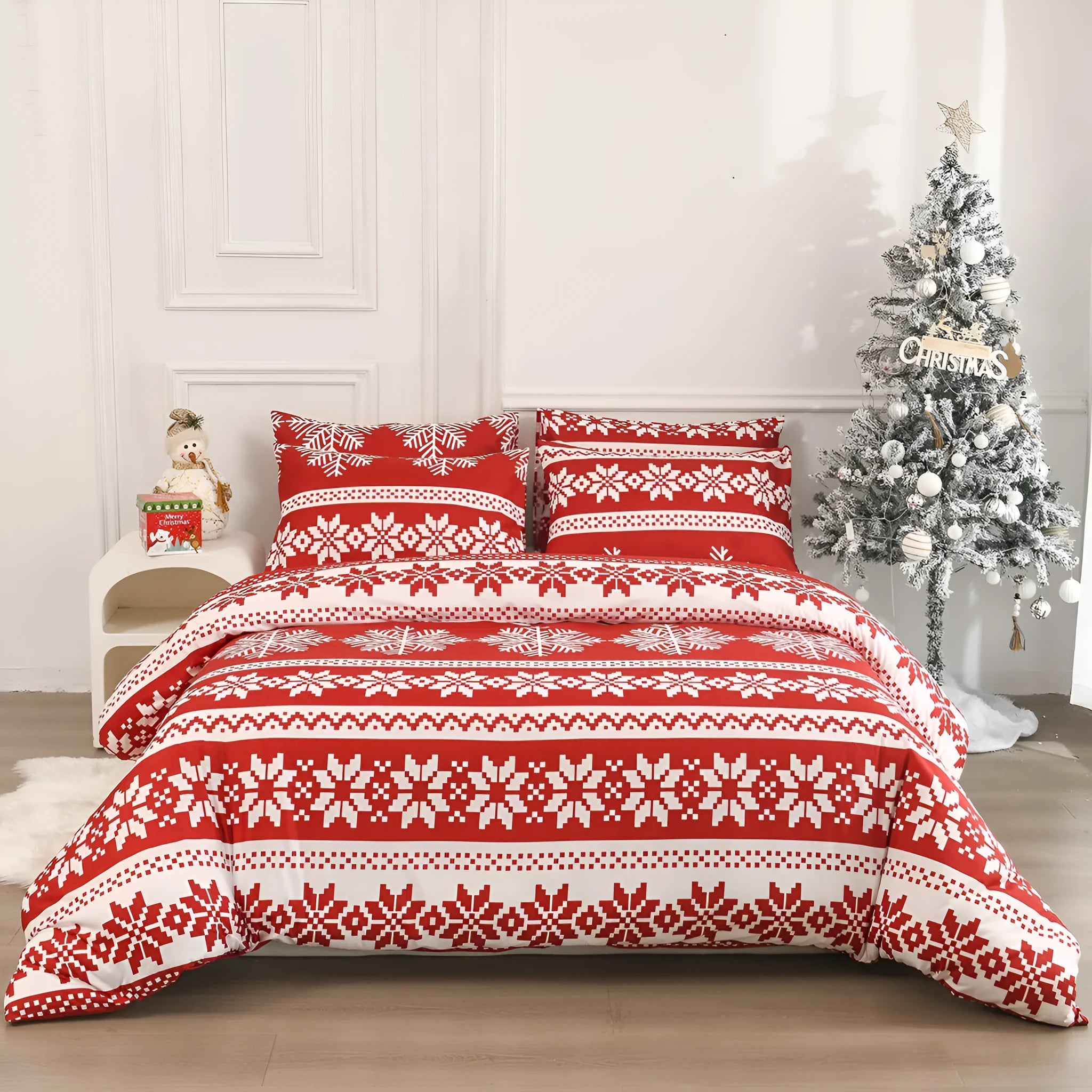 Winter Sleepers pattern three-piece bedding set in red on a bed