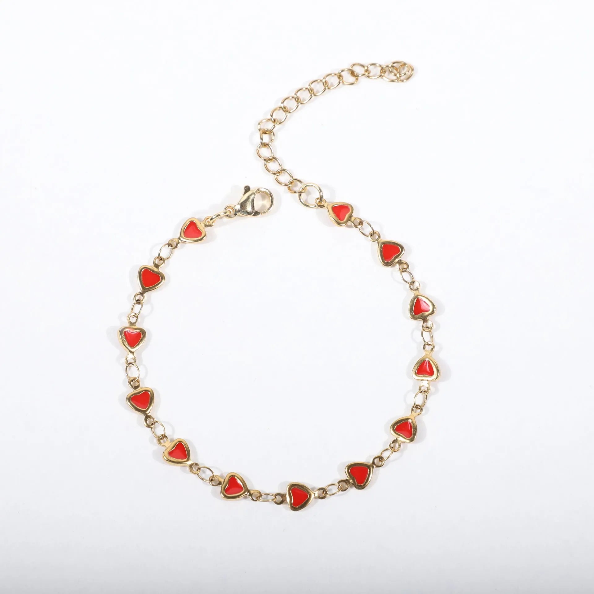 Stainless steel heart bracelet with 18K gold vacuum plating in choice of colours on a 17+5cm chain.