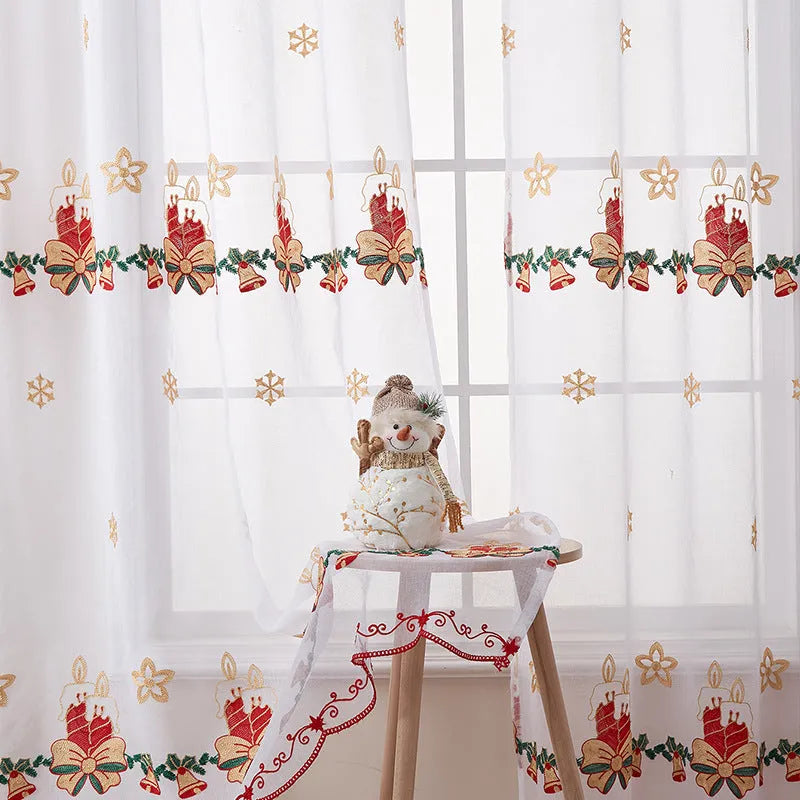 A pair of white polyester curtains with embroidered red Christmas snowflakes in an American style.