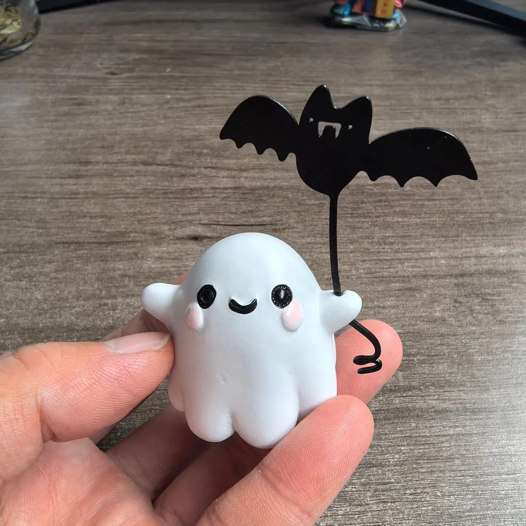 Miniature resin ghost statue walking a dog and holding a bat, Halloween decoration