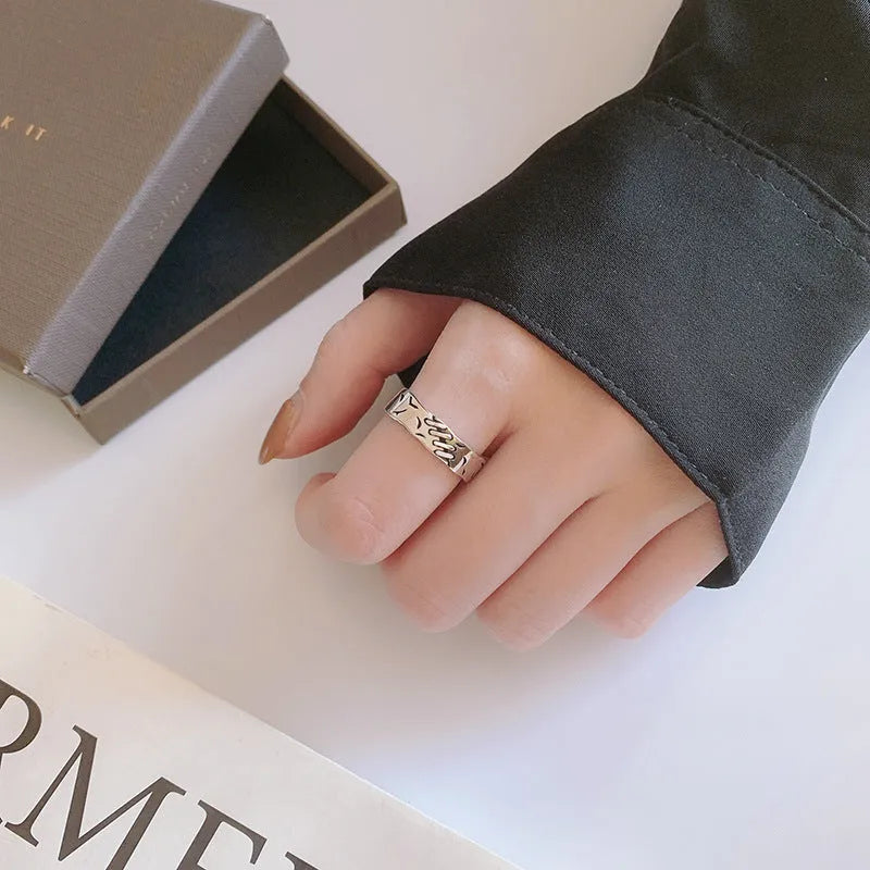 Black geometric copper ring for women with adjustable opening featuring round and oval elements