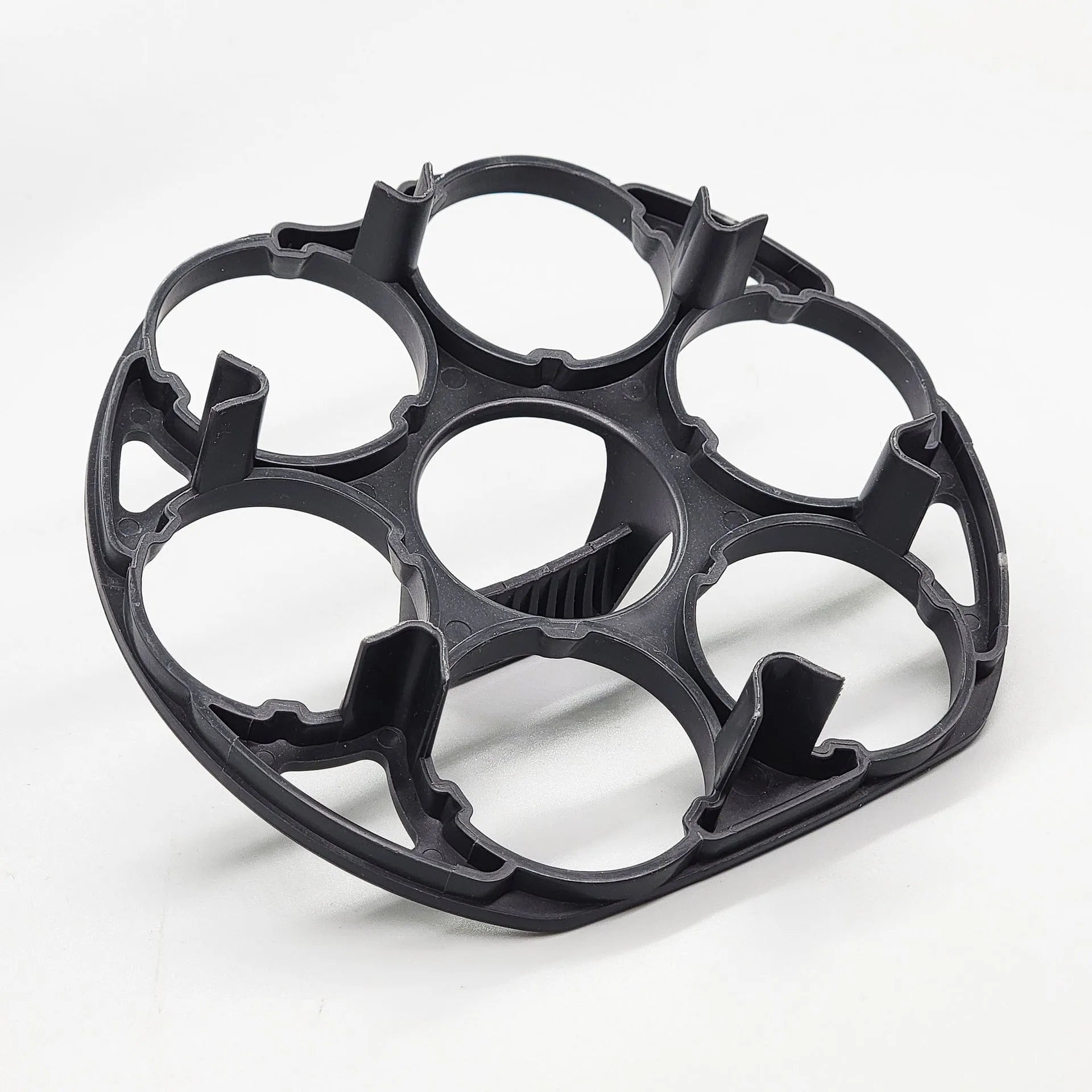 Black plastic egg holder rack with individual compartments measuring 13.8cm wide