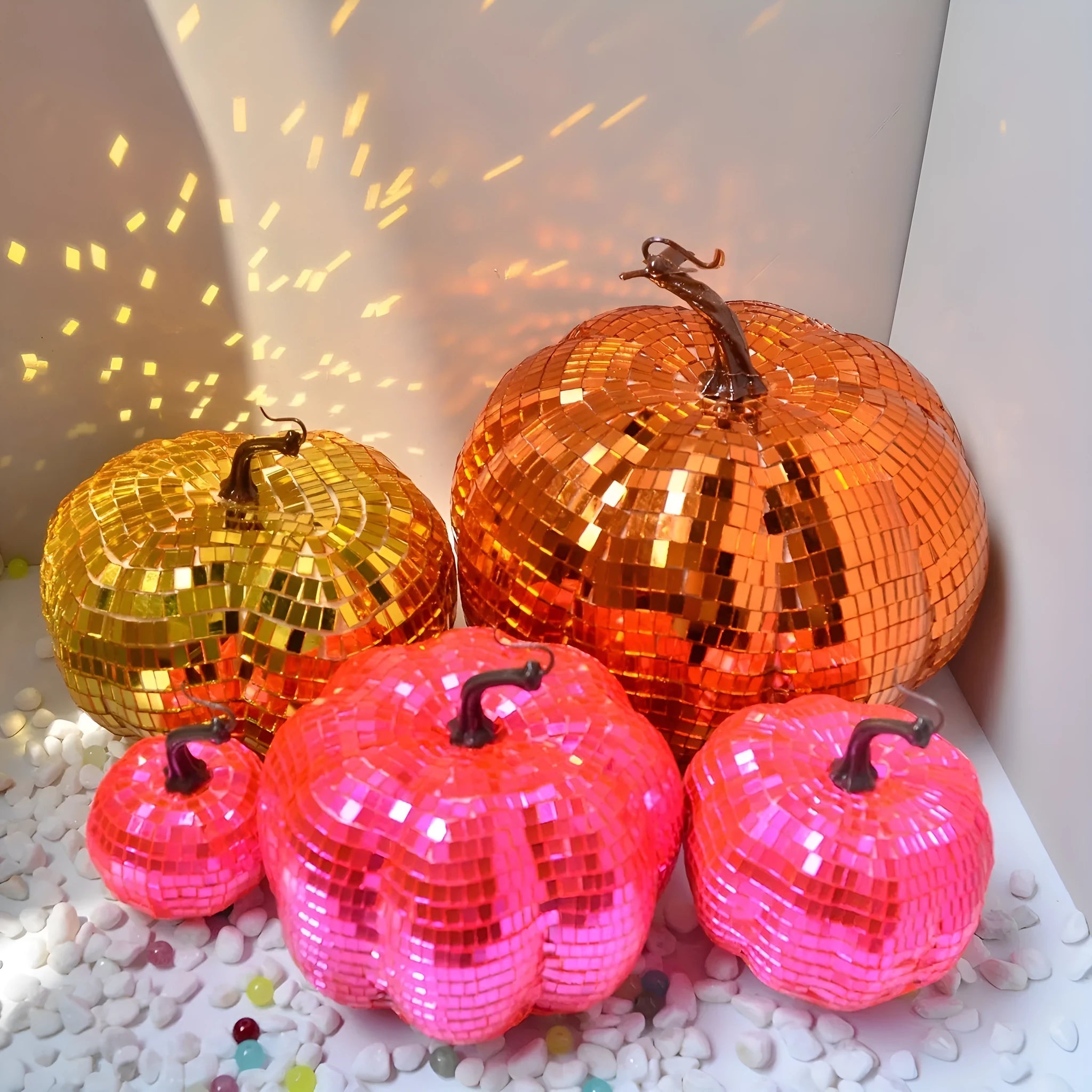 A detailed glass pumpkin decoration with embroidered finish, shown in multiple sizes for Halloween and Christmas.