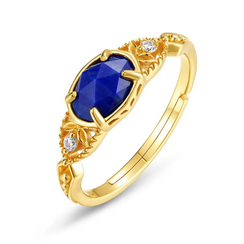 Japanese geometric silver ring with elliptical face and round lapis lazuli stone showing forest night sky colour