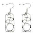 Round geometric earrings with irregular square designs in antique silver finish