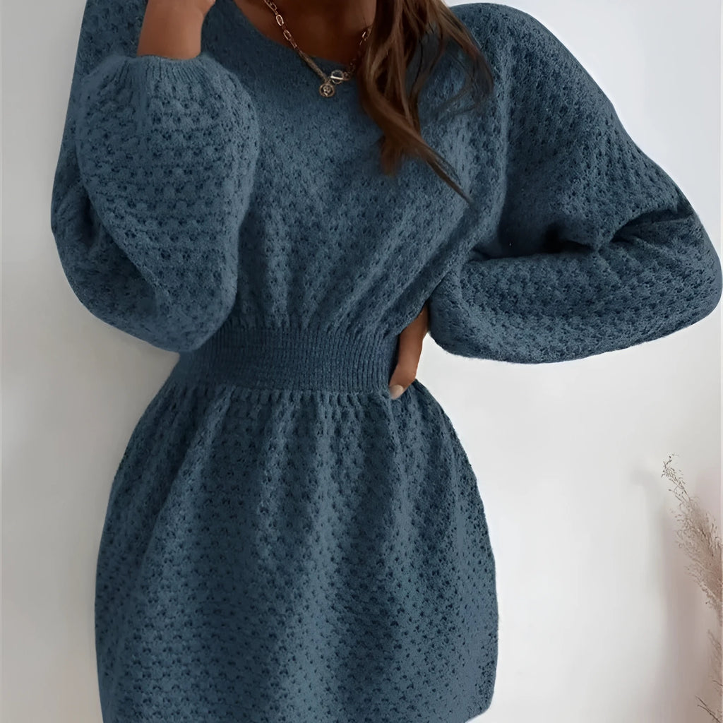 Blue women's knitted dress with hand-crocheted flower details and fitted waist