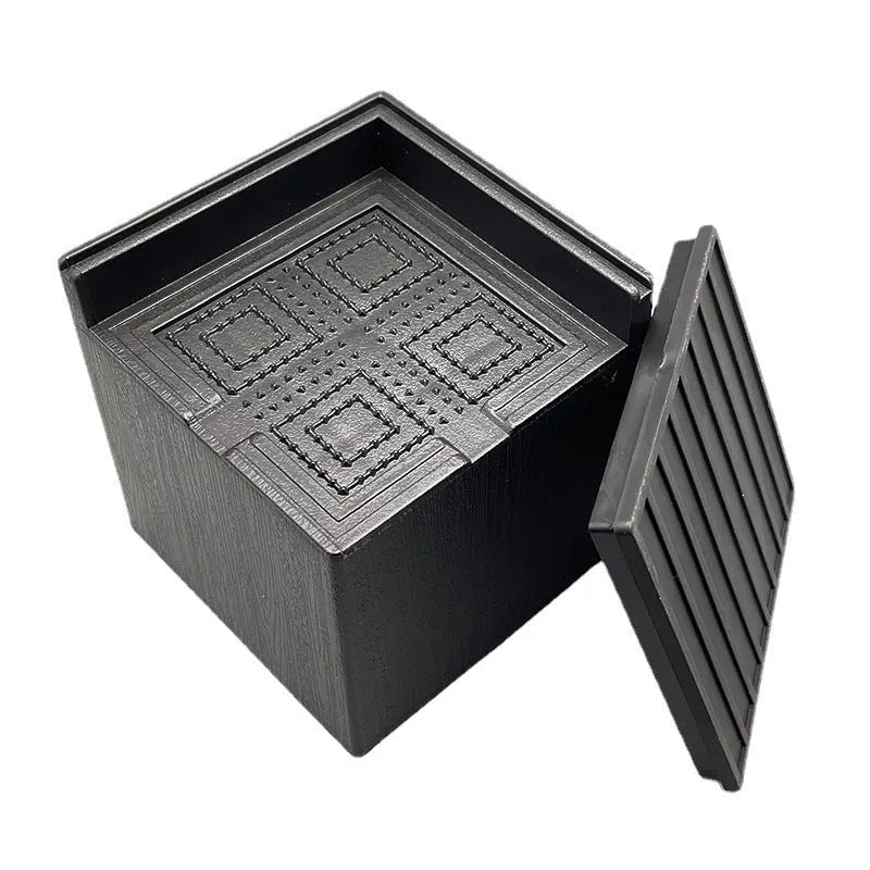 Black plastic furniture foot mat set of four for height adjustment on hard floors