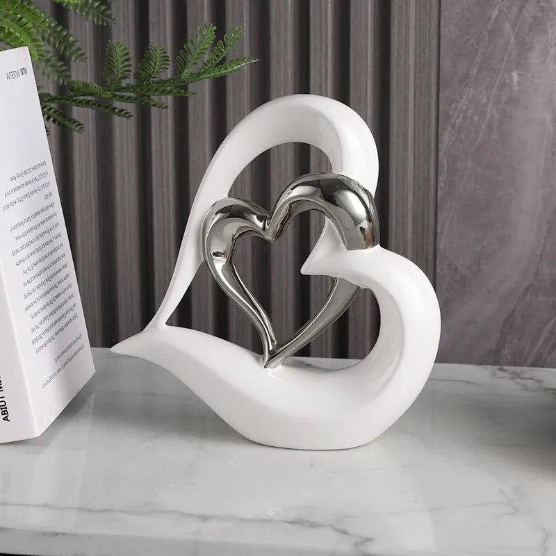 White porcelain love heart ornament in modern geometric style with 1939 Black Gold colour finish on shelf