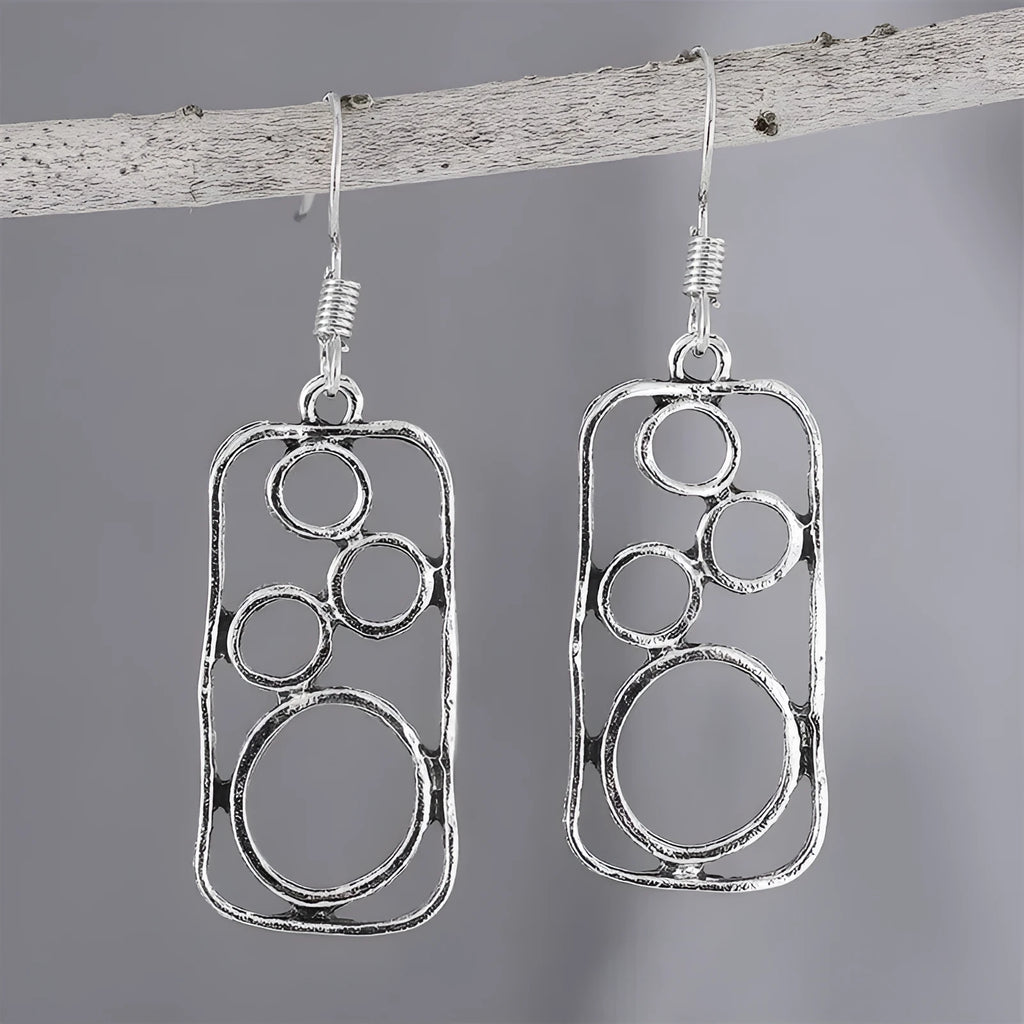 Round geometric earrings with irregular square designs in antique silver finish