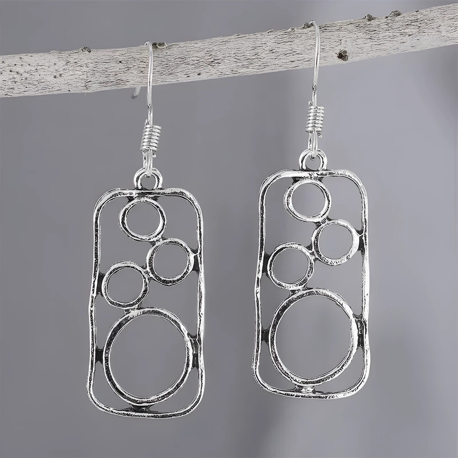 Round geometric earrings with irregular square designs in antique silver finish