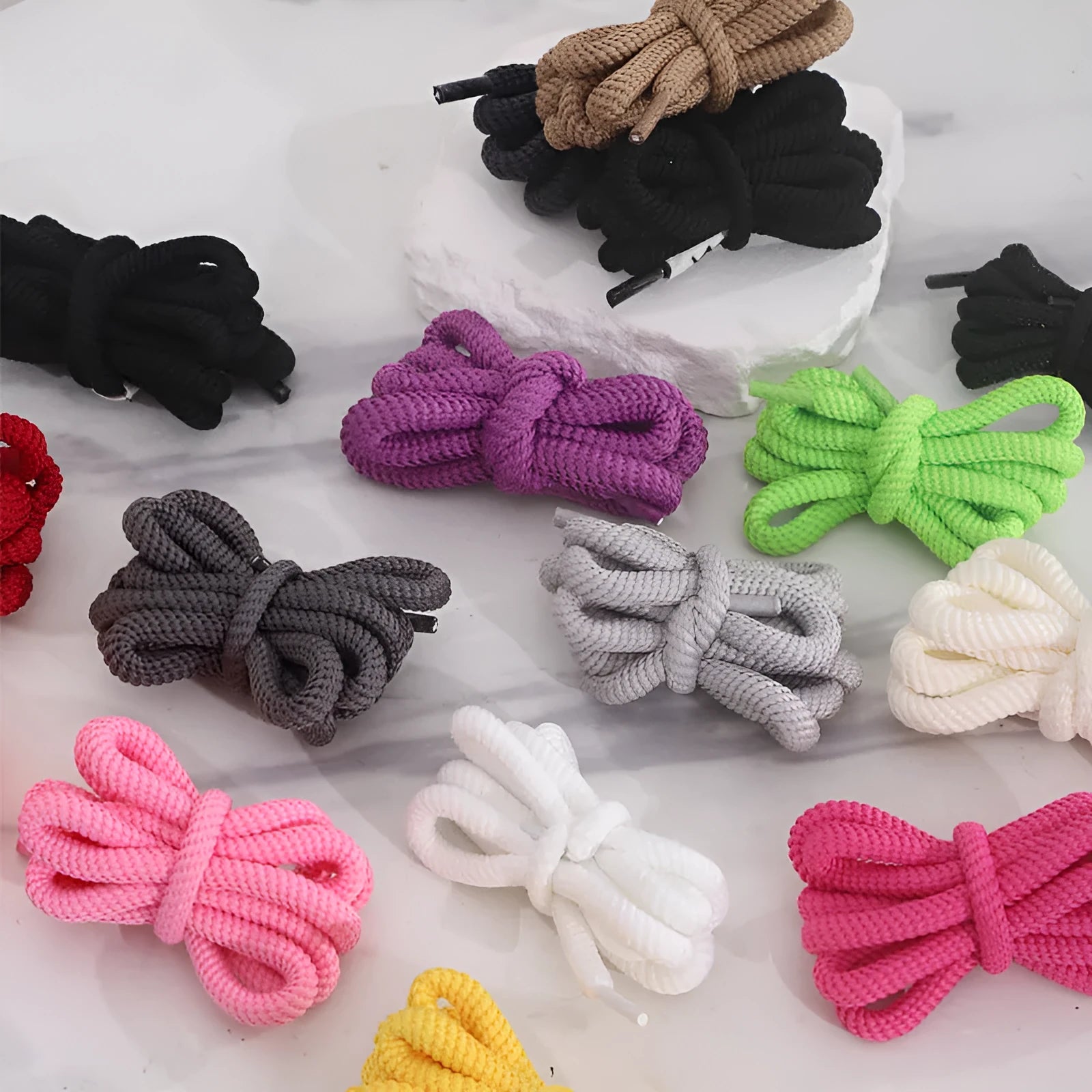 Oval round rope shoelace adapters in various colours showing 1.0 width and length options for sneakers and sweatshirts