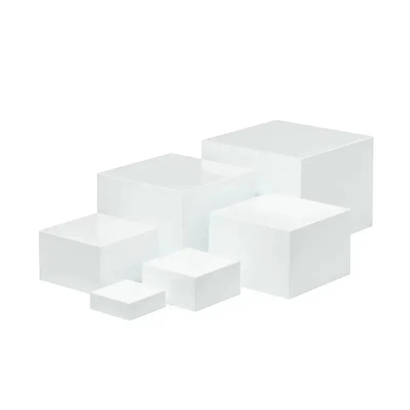 Six white plastic cube-shaped dessert display stands arranged in two rows for patisserie presentation