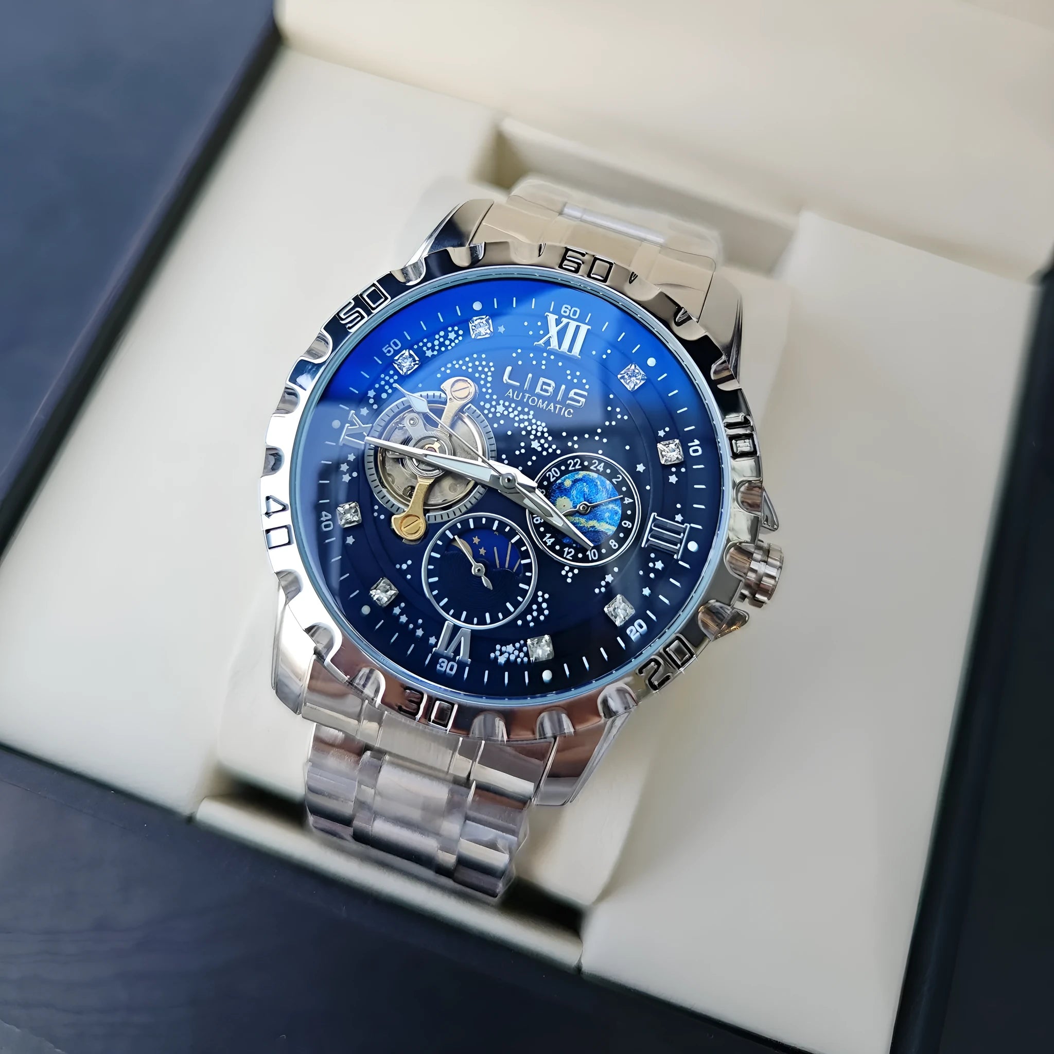 Men's silver case automatic watch with black leather strap and luminous starry dial