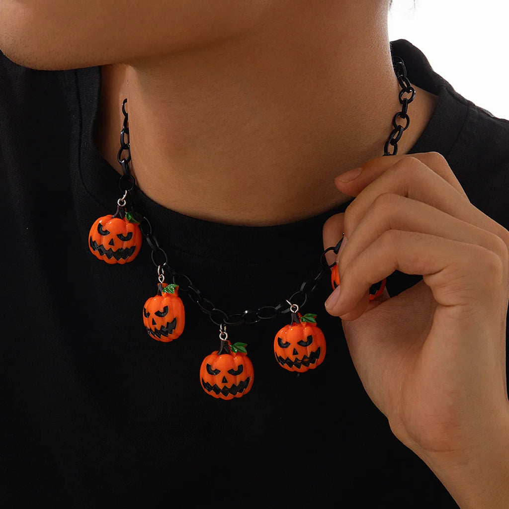 Halloween necklace with acrylic ghost and pumpkin pendant in mixed colours on regular chain