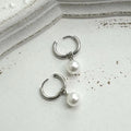 Women's geometric pearl earrings with alloy construction and titanium steel components