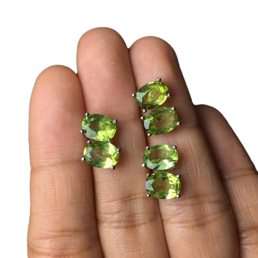 Natural grass green olivine stud earrings in S925 sterling silver with 6×8mm elliptical faceted gemstones.