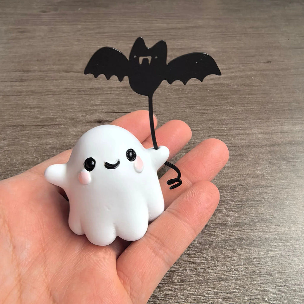 Miniature resin ghost statue walking a dog and holding a bat, Halloween decoration
