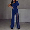 Black oblique shoulder high slit women's long sleeve jumpsuit on a model.