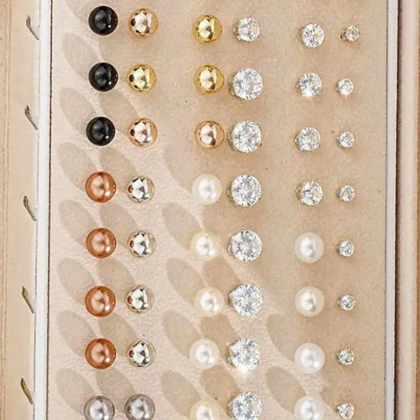 108 geometric round pearl earrings in gold and yellow electroplated alloy finishes displayed as a collection
