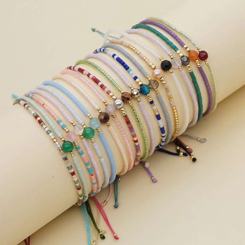 Handmade Bohemian women's bracelet with colourful geometric semi-precious and glass lucky stone beads.