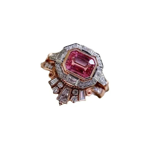 Women's rose gold colour alloy ring with geometric ruby-coloured centrepiece on finger
