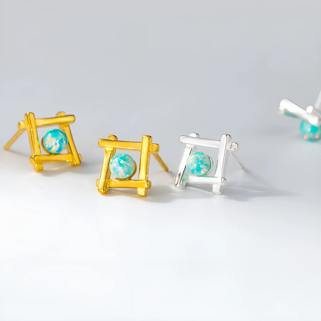 Geometric cross quadrangle stud earrings in 925 silver with Seiko treatment, silver and gold colour options