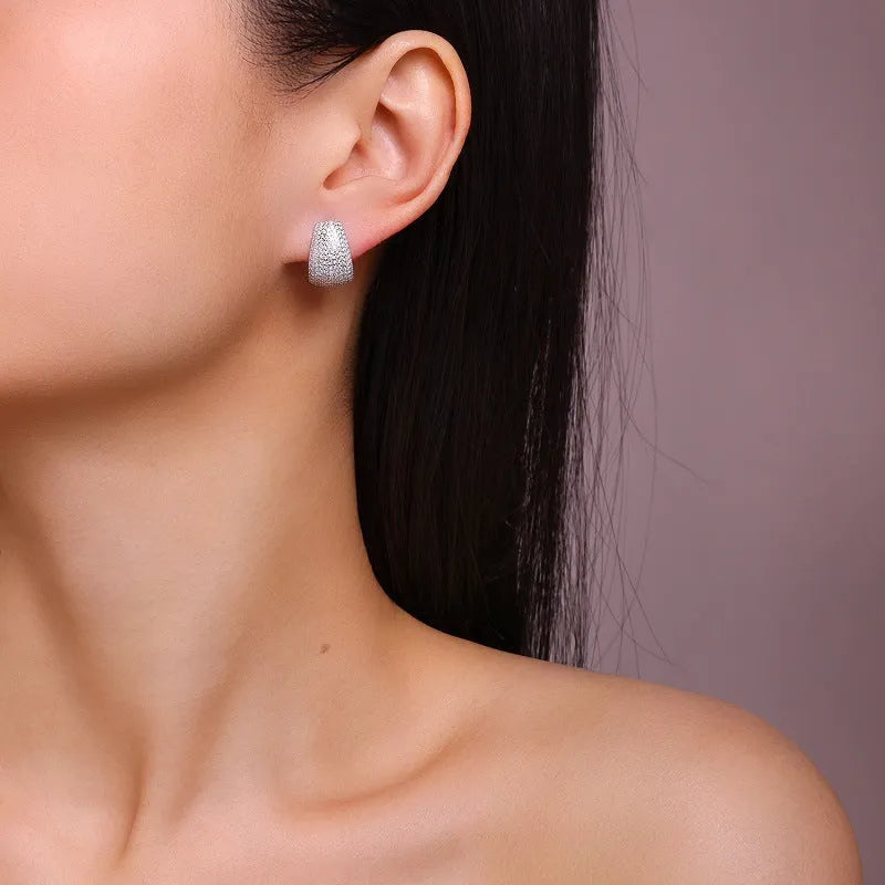 Geometric sterling silver stud earrings with moissanite stones in gift box