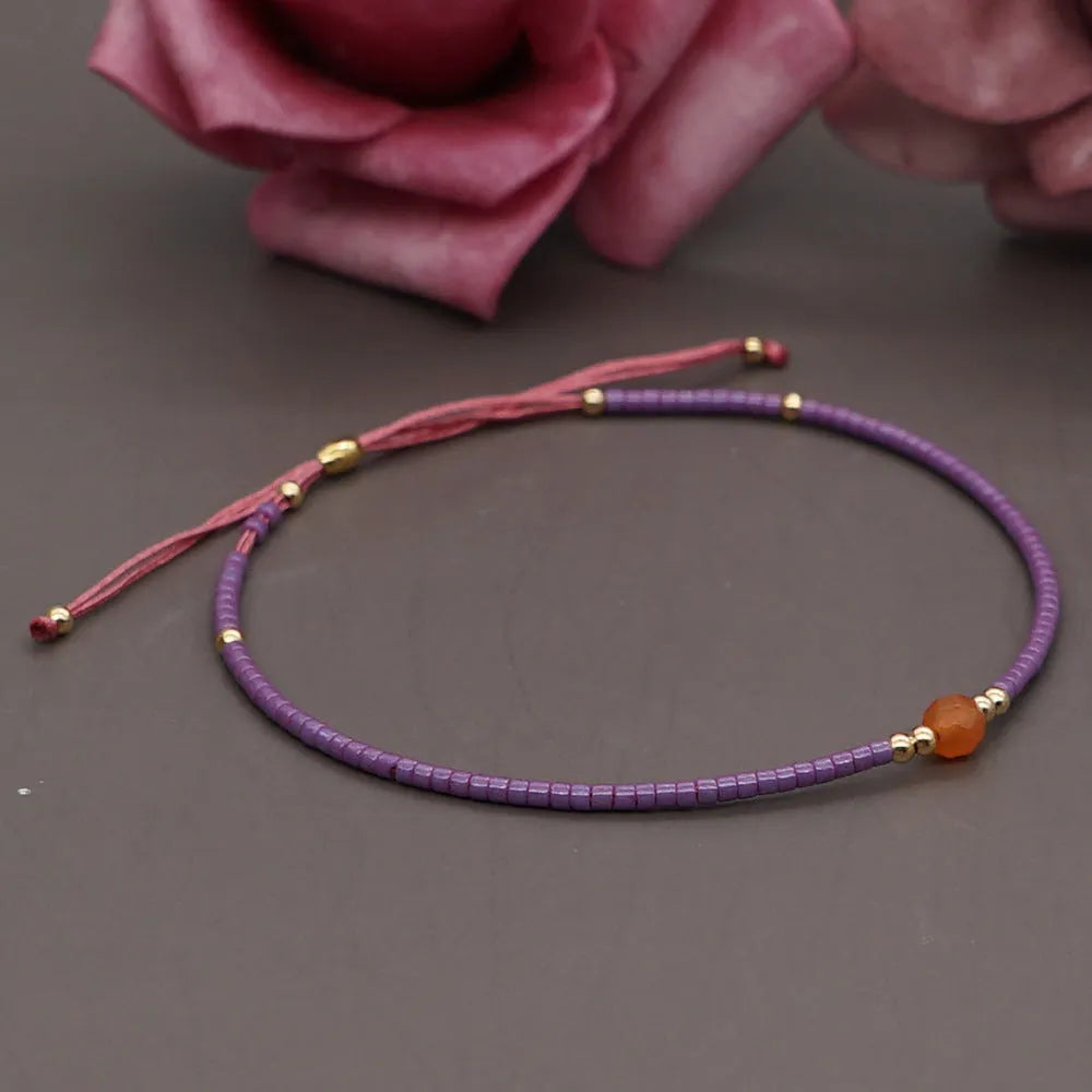 Handmade Bohemian women's bracelet with colourful geometric semi-precious and glass lucky stone beads.