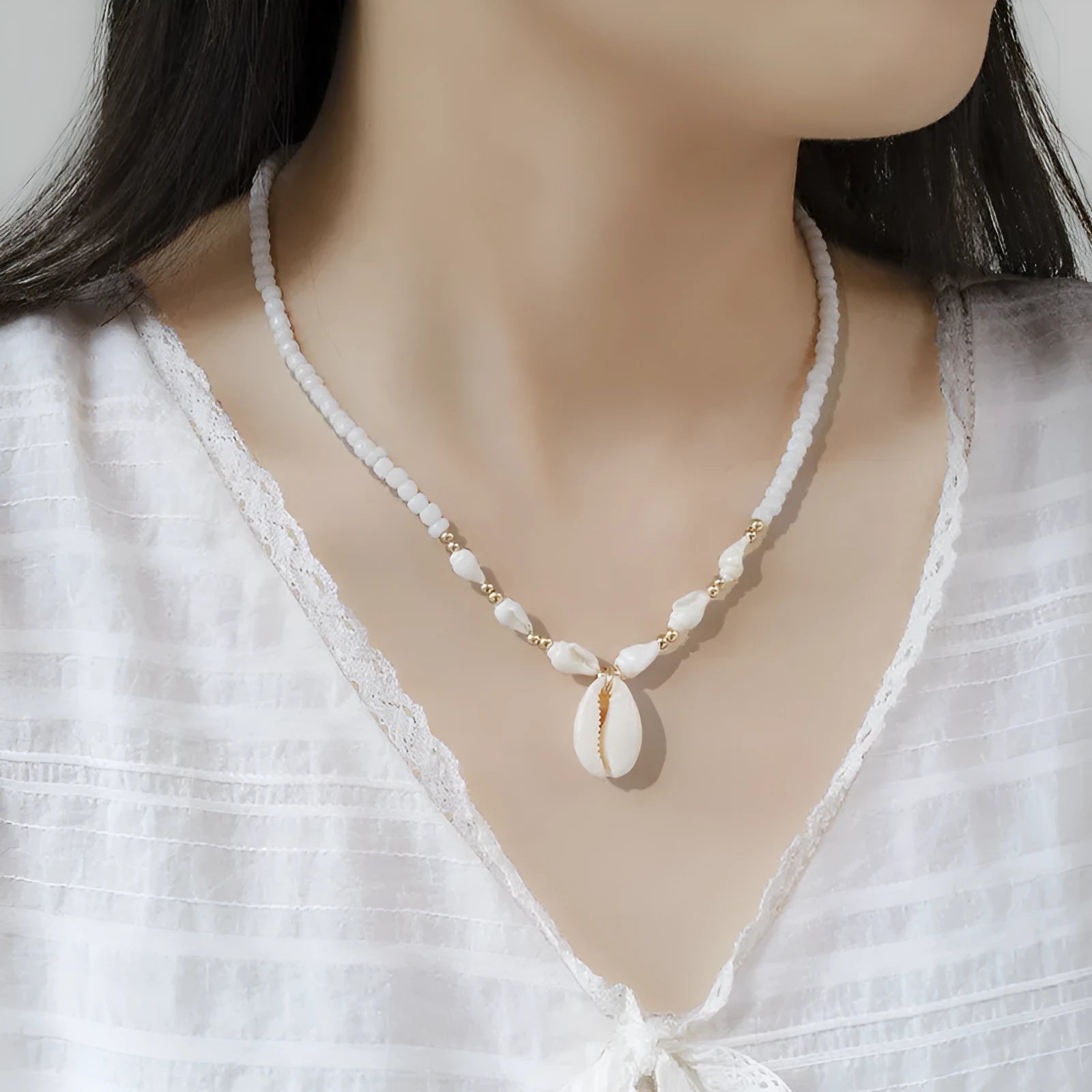 White mother pearl shellfish conch bead necklace with electroplated finish and shell pendant on regular chain