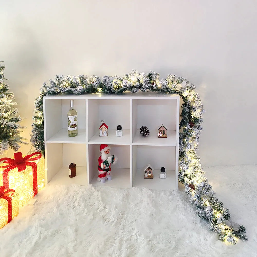 Flocked PVC Christmas rattan garland with 240 colourful heads draped over a mantelpiece