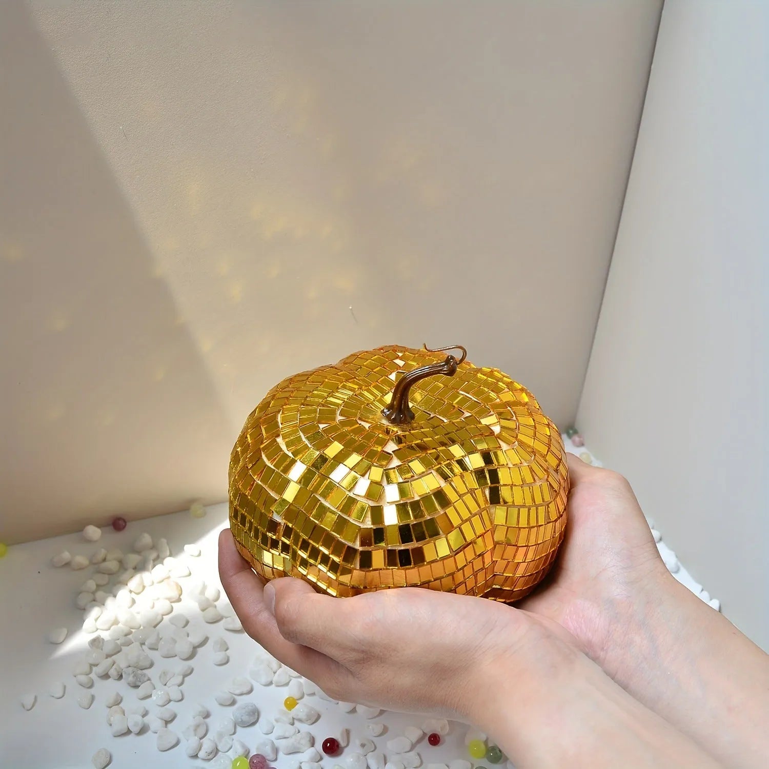 A detailed glass pumpkin decoration with embroidered finish, shown in multiple sizes for Halloween and Christmas.