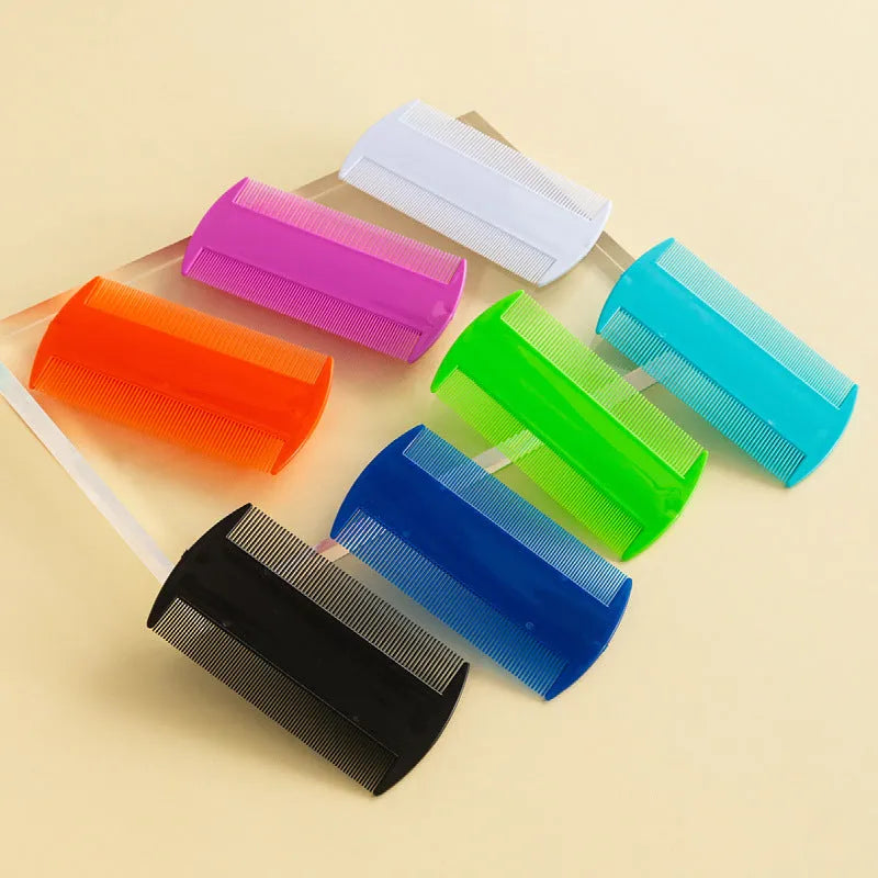 Plastic fine tooth double-edged lice comb on a white background.