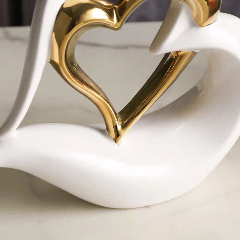 White porcelain love heart ornament in modern geometric style with 1939 Black Gold colour finish on shelf